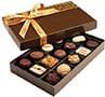 A box of chocolates with a gold ribbon.
